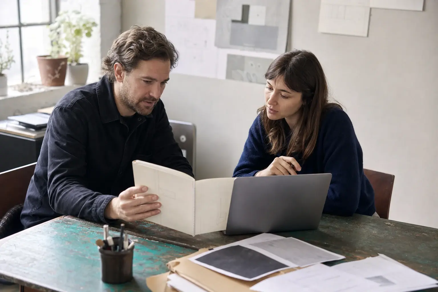Two people reviewing a working process together